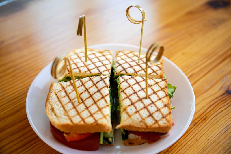 Grilled chicken club sandwich with lettuce, tomato and avocado