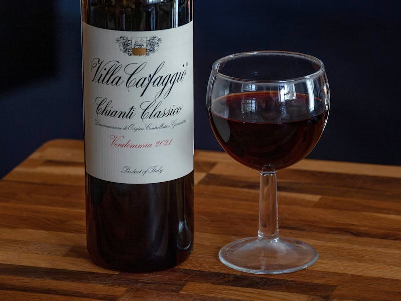 Glass of house red wine paired with Italian food